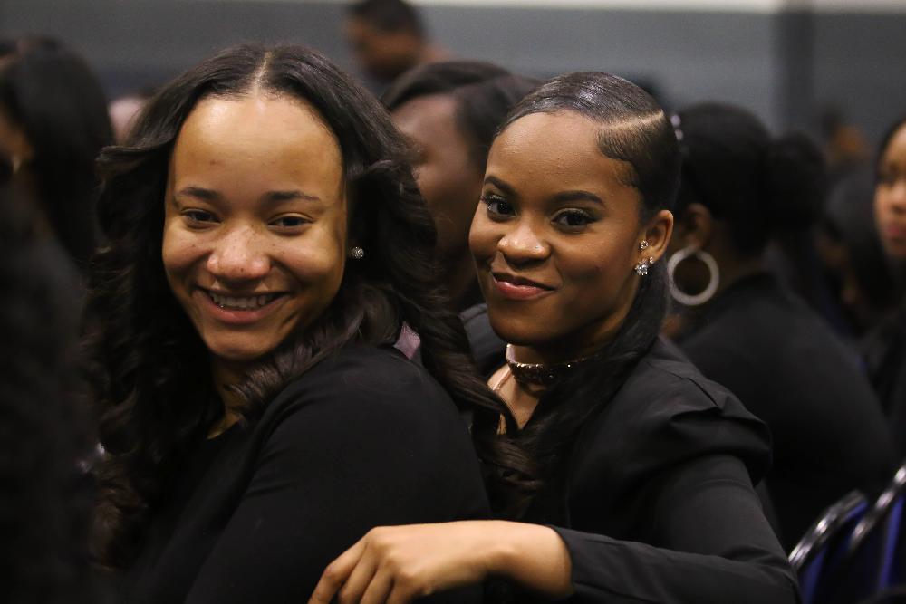 two black students posing for photos